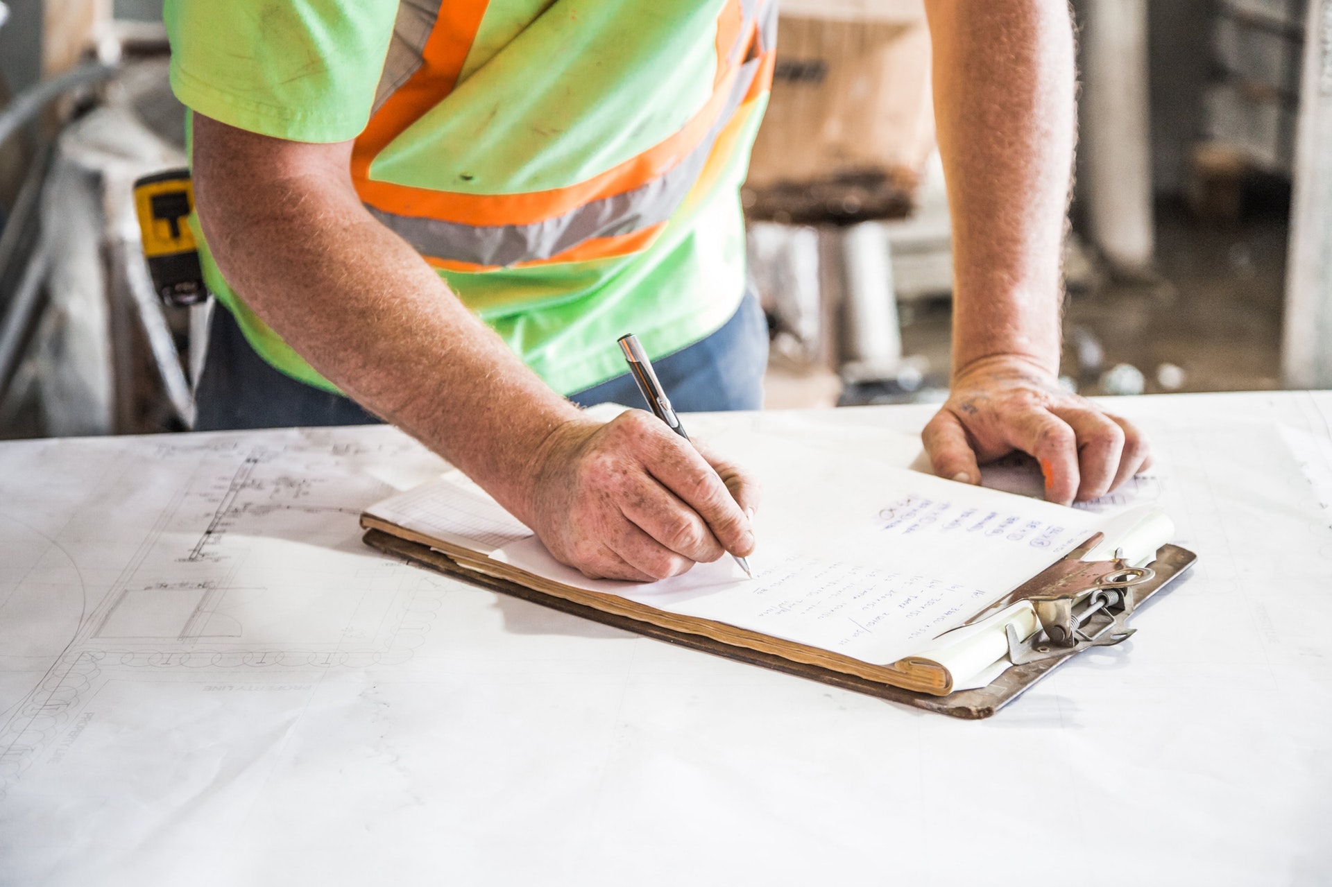 construction worker signing paper